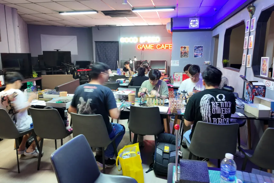 Builders at work during a session at Good Speed Game Cafe